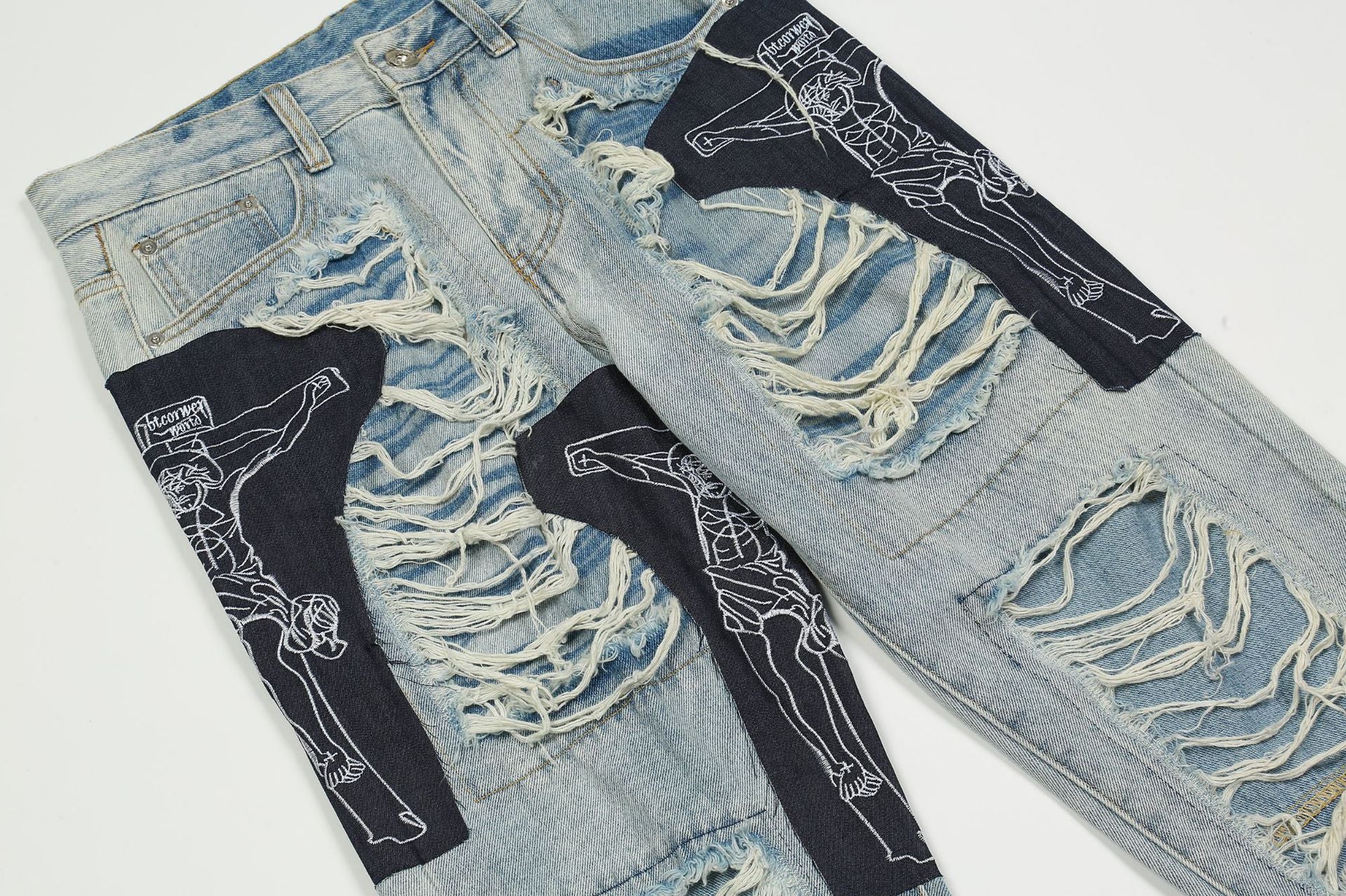 Zerrissene Jesus-Patchwork-Jeans