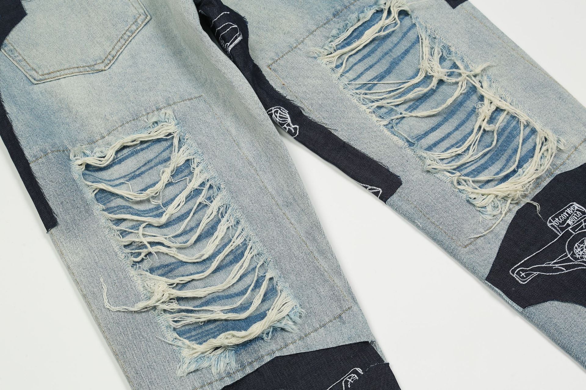Zerrissene Jesus-Patchwork-Jeans
