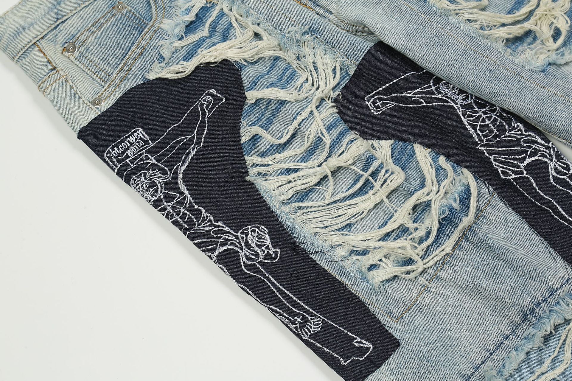 Zerrissene Jesus-Patchwork-Jeans