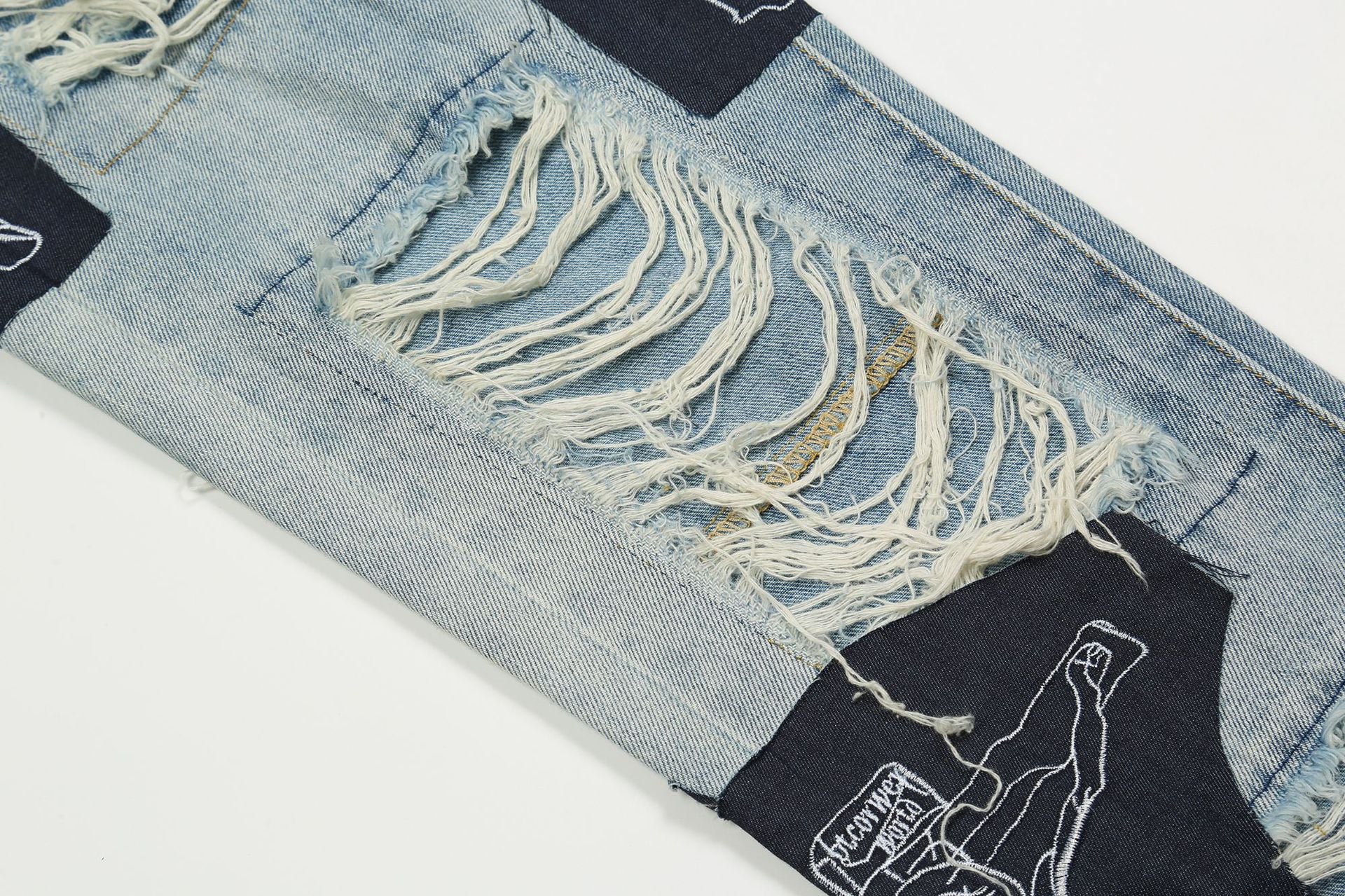 Zerrissene Jesus-Patchwork-Jeans