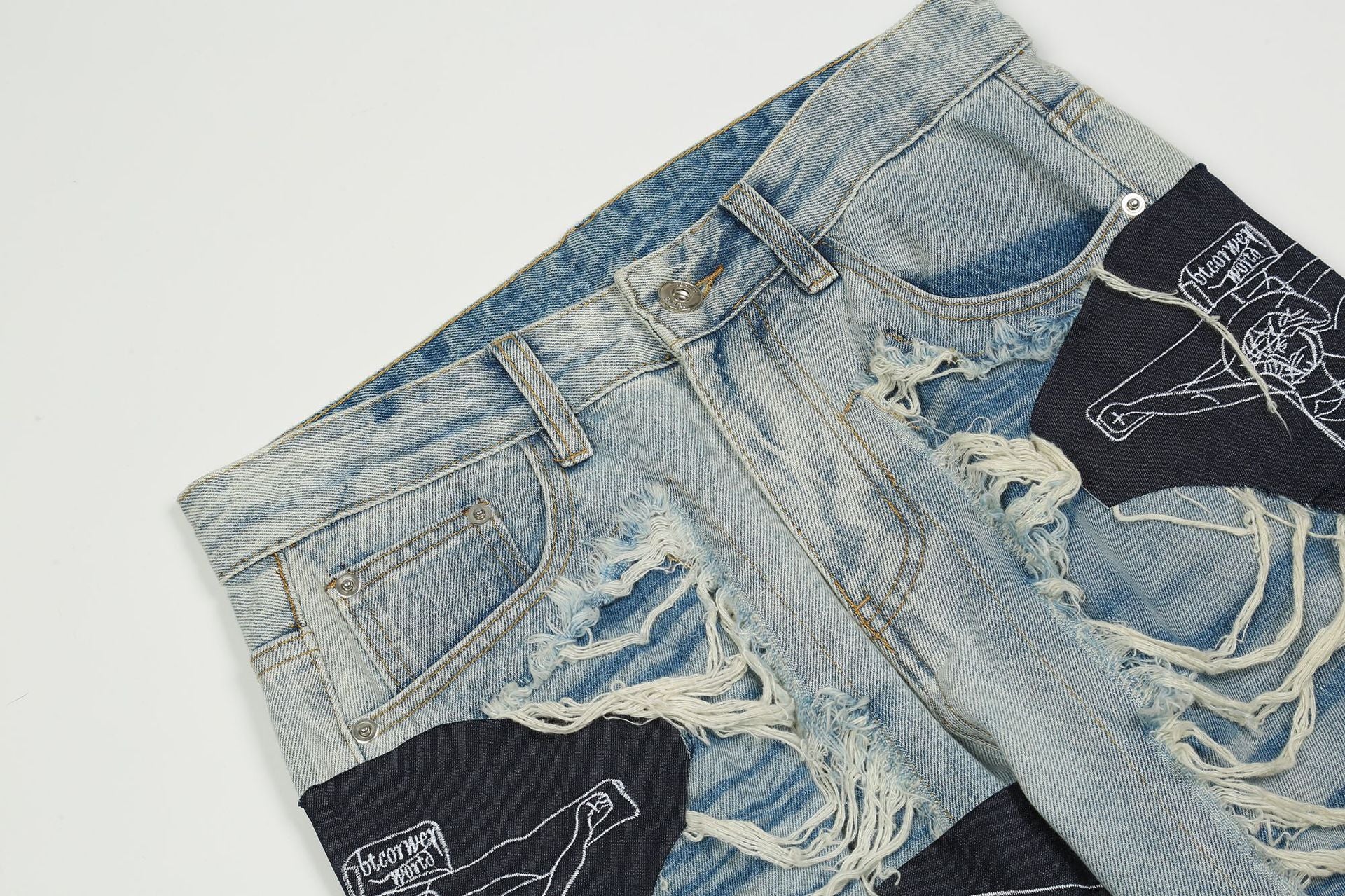 Zerrissene Jesus-Patchwork-Jeans